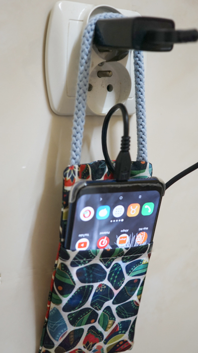 Hanging phone case and cable holder 46