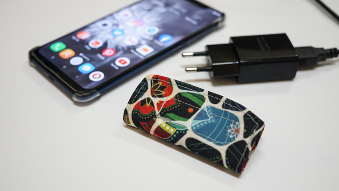 Hanging phone case and cable holder 54