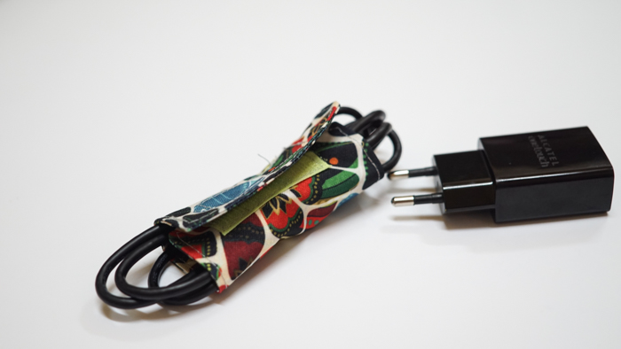 Hanging phone case and cable holder 56